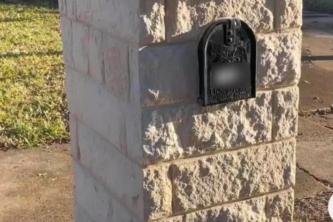 Stone mailbox column with a cap stone