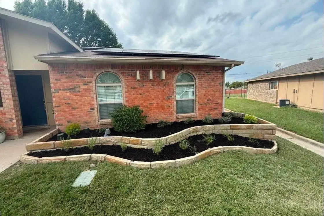 Two-tier stone beds with new plants photograph